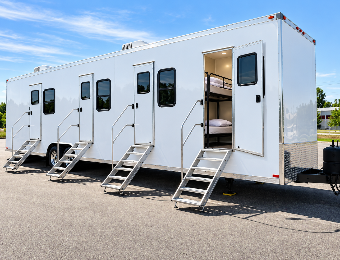 White mobile accommodation trailer with separate entry doors and steps